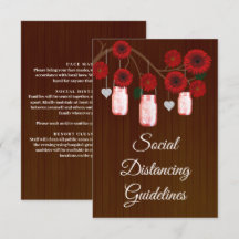 Mörka rustika röda blomsterarrangemang i murskål s