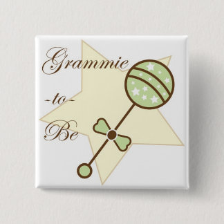 Mormodern som är baby shower, klämmer fast knapp