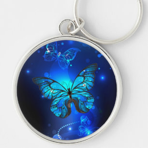 Morpho Butterfly i Mörkens bakgrund Rund Silverfärgad Nyckelring