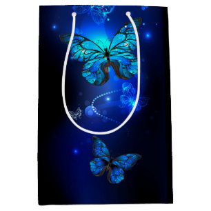 Morpho Fjäril i den mörka Bakgrunden