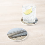 Morro Bay California Ocean Photography Underlägg<br><div class="desc">A foggy overcast day in Morro Bay California with the ocean waves hitting the rocks on the shore in this beach photograph souvenir. This seaside travel photo keepsake coaster gift features black cursive script above the beach rocks and grey sky.</div>