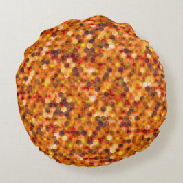 Mosaik av hexagoner på prickar i rödfärgade toner  rund kudde