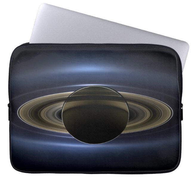 Mosaik av mättnadssystemet som bakgrundsbelysts av laptop fodral (Framsidan)