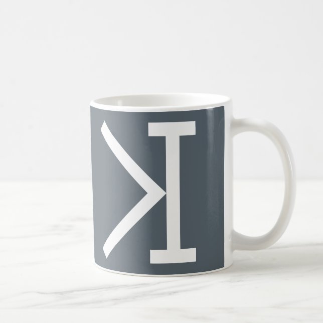 "Möter mer än (>) pusselmuggen för ögat (I) " Kaffemugg (Höger)