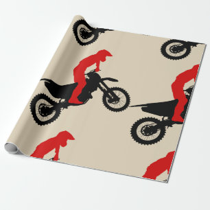 Motorcross ryttare som slår in papper presentpapper