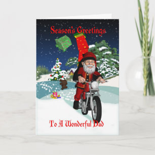 Motorcykeltomten pappa med flyggåvor och vinter helgkort
