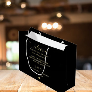 Mottagande hotellgästväskor i Guld-skript bröllop