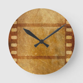 MOVIE REEL OLD-FASHIONED GRUNGE GULD BACKGROUND DI RUND KLOCKA