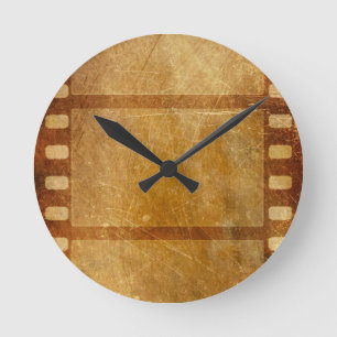MOVIE REEL OLD-FASHIONED GRUNGE GULD BACKGROUND DI RUND KLOCKA