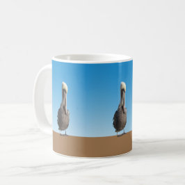 Mugg - Pelikaner på land
