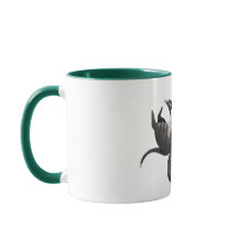 Mugg| Två katter ljuger med en växt