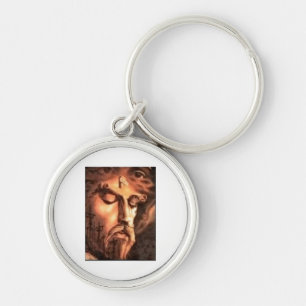 MULTPLE ANSIKTE AV JESUS RUND SILVERFÄRGAD NYCKELRING