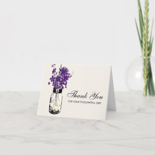 Murad glasburk fylld med vilda blommor tack kort