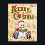 Musical Christmas Greetings Helg Vykort<br><div class="desc">Racoons and snowman singing Christmas Carols.

© HTM Images</div>