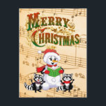 Musical Christmas Greetings Helg Vykort<br><div class="desc">Racoons and snowman singing Christmas Carols.

© HTM Images</div>