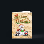 Musical Christmas Greetings Helgkort<br><div class="desc">Cute racoons and snowman singing Christmas Carols.

© HTM Images</div>