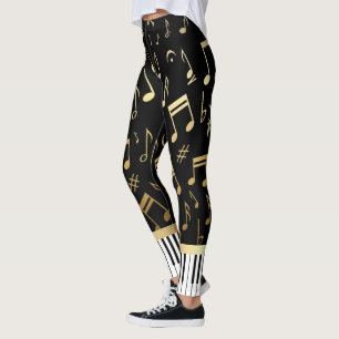 Musik noter- och pianonyckelsvart och guld leggings