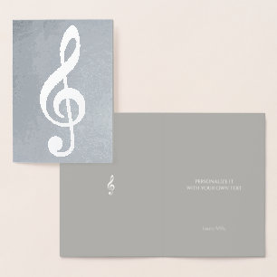 musikanteckning/treble clef på silver folierat kort