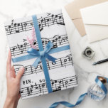 Musiksammansättning på trä presentpapper<br><div class="desc">Lakan-musik på viftad träbakgrund. Bakgrunden kan ändras.</div>