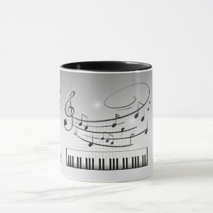 Musiktangentbord och noterar mugg