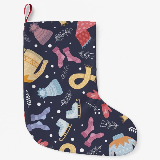 Mysigt vintertid sak mot blå bakgrund. Knitten c Liten Julstrumpa (Framsidan)