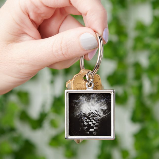 Mystisk mask med spiral fyrkantig silverfärgad nyckelring (Hand)
