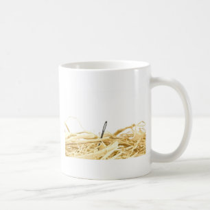 nål i en höstack kaffemugg