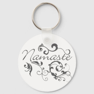 Namaste i mörk grått-snurrar nyckelring
