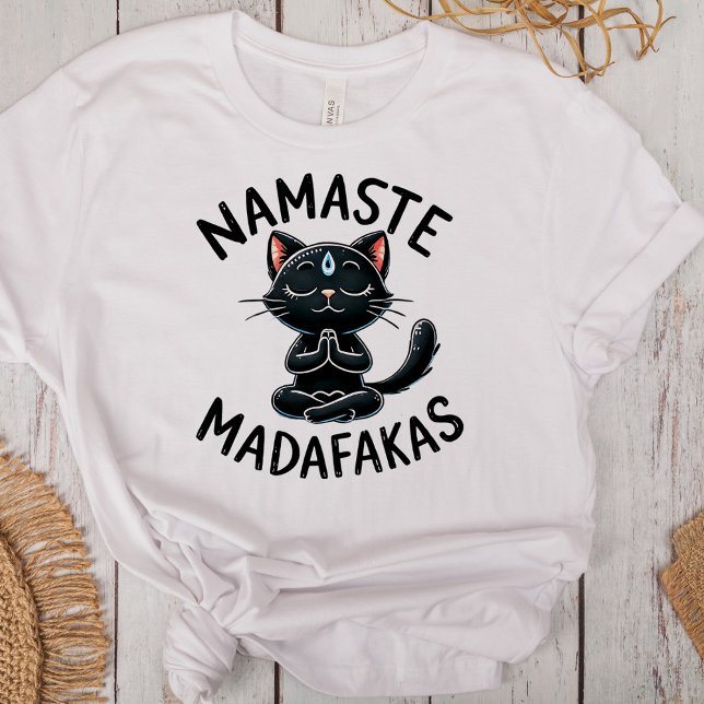 "Namaste Madafakas" Funny Cat Lovers T Shirt ("Namaste Madafakas" Funny Cat Lovers Tri-Blend Shirt on a desk with boho decoration)