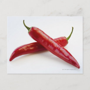 Nära rödchili paprika på vitt vykort