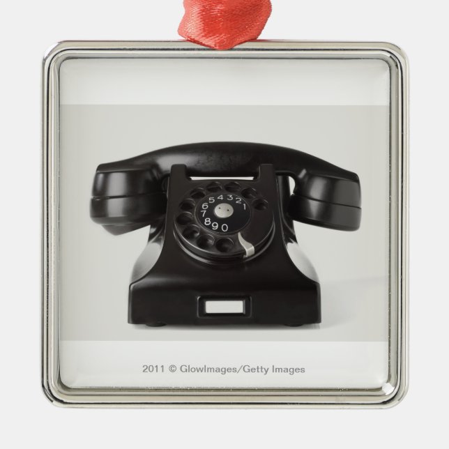 Närbild av en roterande telefon julgransprydnad metall (Framsidan)