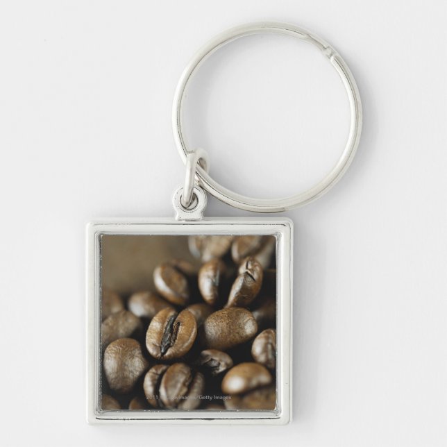 Närbild av kaffebönor fyrkantig silverfärgad nyckelring (Framsidan)
