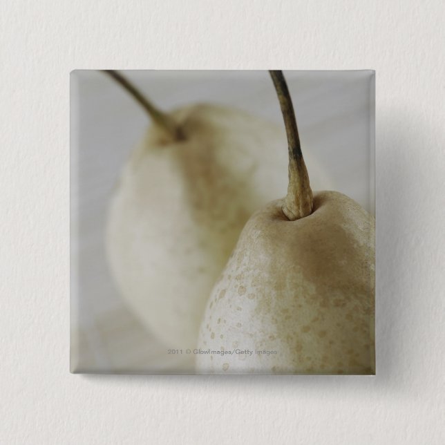 Närbild av två pears knapp (Framsida)