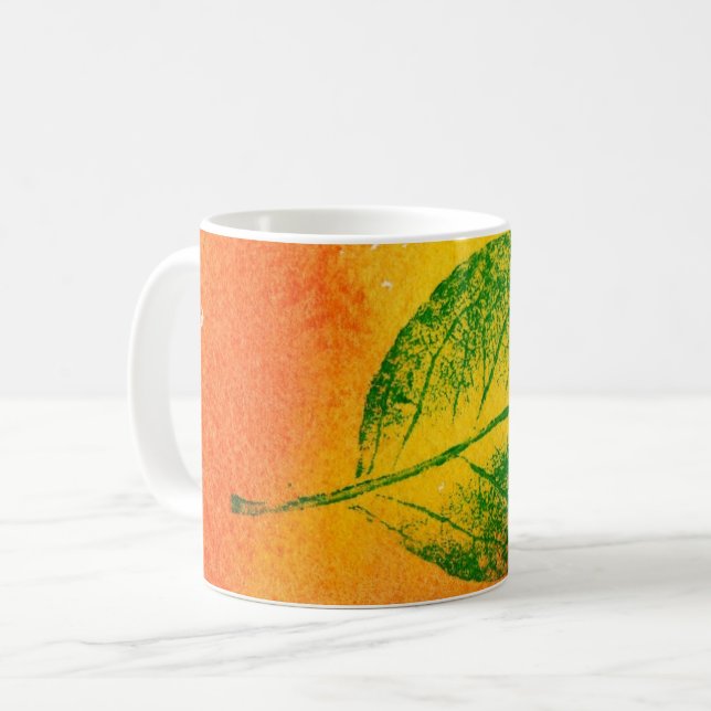 Nature Löv Print grönt on orange, gult äpple. Kaffemugg (Framsida vänster)