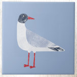Nautical Fiskmås Bird Himmel Blue Kakelplatta<br><div class="desc">En roligt och en fuktig svart,  gull som stod vid havet. Perfekt för dem som kärlek kusten. Originalkonst av Nic Squirrell.</div>