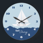 Nautical Sailboat Stor Klocka<br><div class="desc">Stylish nautical wall clock featuring a white sailing boat silhouette on a soft blue background with deep blue ocean waves. The design captures the peaceful feeling of the sea and open horizons. The phrase “Sail Away” adds a sense of adventure and freedom, perfect for lovers of the ocean and coastal...</div>