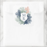 Nautisk monogram Oceanen Beach Marine Bröllop Fyrkantigt Klistermärke<br><div class="desc">Lägg till en liten marktelegans i firande med våra Nautical Monogram Ocean Beach Marine Bröllop-etiketter. De här vapensköldarna har en vattenfärgen stil nautisk med mjuk, blå koralldetaljer och ett monogram för anpassadet i mitten och är perfekt för att lägga till en personlig som avslutar till dina bröllopsfavoriter, välkomstpåsar eller inbjudningskuvert....</div>