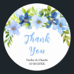 Navy and Baby Blue Floral Wedding Thank You Runt Klistermärke<br><div class="desc">This beautiful and elegant wedding thank you sticker features watercolor baby blue and navy blue flowers with foliage. The text combines handwritten script and serif fonts for a stylish and modern look. This is perfect for a spring or summer rustic wedding.</div>