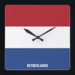 Nederländska Flagga Patriotic Fyrkantig Klocka<br><div class="desc">Nederländernas nationella Flagga Patriotic Square Wall Clock med flagga land i färg tryckt hela tiden. Land namn är delvis integrerat i utformningen på grund. Anpassadet Text är fullt ut med funktionen "Anpassa den!". Den här charmerande utformningen är den häpnadsväckande presenten och den underbara show biet på väggen. © LänderAvVärlden</div>