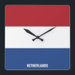 Nederländska Flagga Patriotic Fyrkantig Klocka<br><div class="desc">Nederländernas nationella Flagga Patriotic Square Wall Clock med flagga land i färg tryckt hela tiden. Land namn är delvis integrerat i utformningen på grund. Anpassadet Text är fullt ut med funktionen "Anpassa den!". Den här charmerande utformningen är den häpnadsväckande presenten och den underbara show biet på väggen. © LänderAvVärlden</div>
