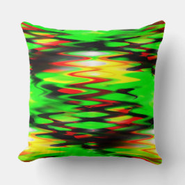 Nedfläckad röd och grönt som bildar abstrakt zigza kudde