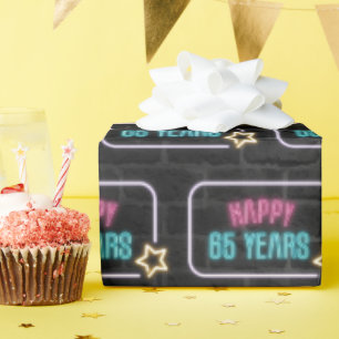 Neon 65e Birthday Marquee on Brick Presentpapper