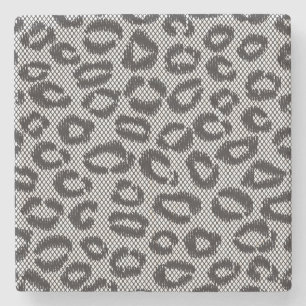 Netto snöre för svart med leopardmönster på vit underlägg sten