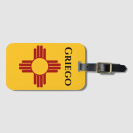 New mexico flagga med symbolen Zia Bagagebricka
