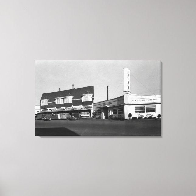 Newport, Oregon View of Bay Way Caf � Photograph Canvastryck (Framsida)