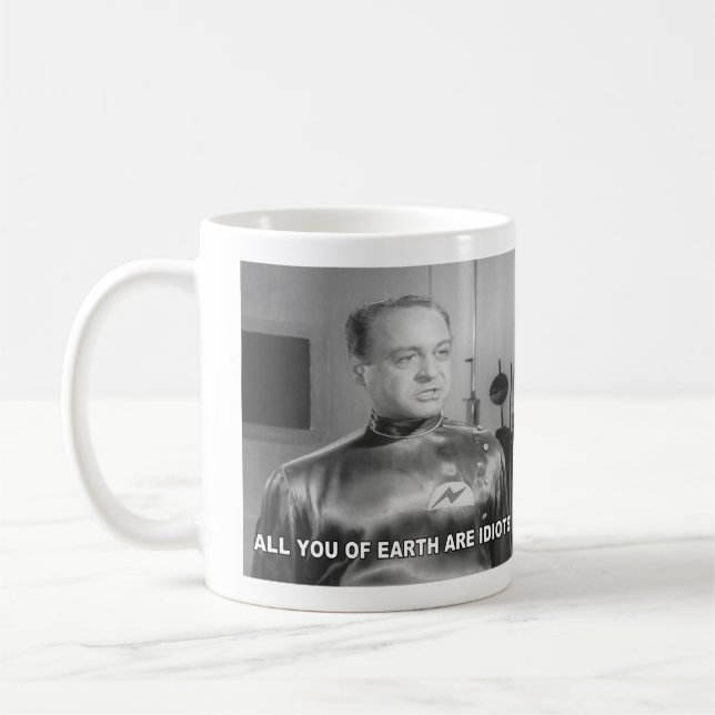 Ni alla på jorden är idioter kaffemugg (Vänster)