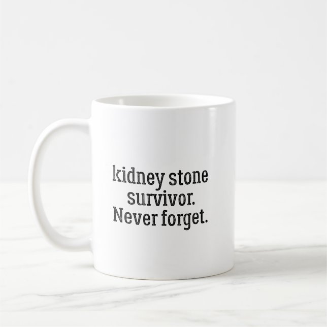 Njurstenöverlevare Glömmer Aldrig Kaffemugg (Vänster)