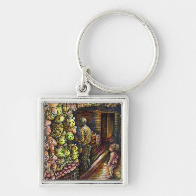 Norr om cirkusen fyrkantig silverfärgad nyckelring (Framsidan)