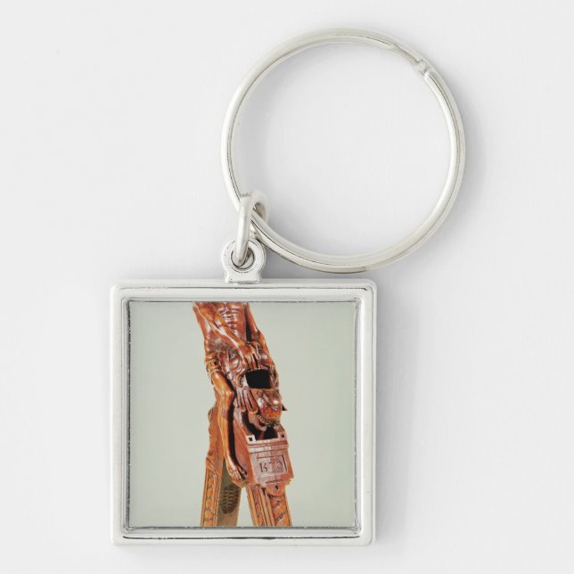 Nötknäppare i form av en man fyrkantig silverfärgad nyckelring (Framsidan)