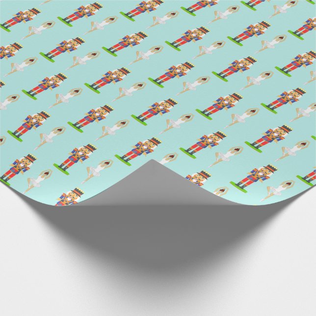 Nötknäppare och balettdansare på ljust teal presentpapper (Hörn)